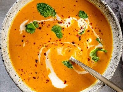 Curried pumpkin soup with coconut milk, fresh herbs, and crushed red pepper.