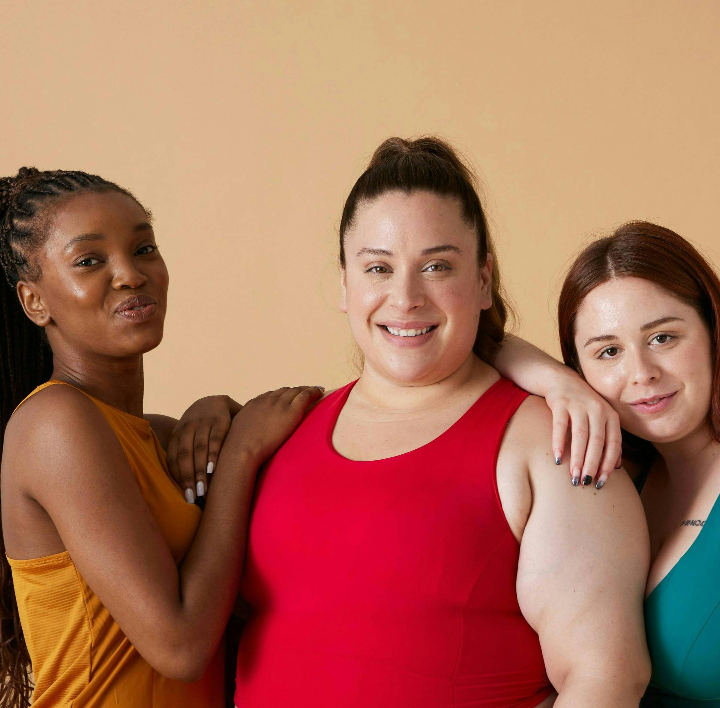 Diverse group of women smiling.