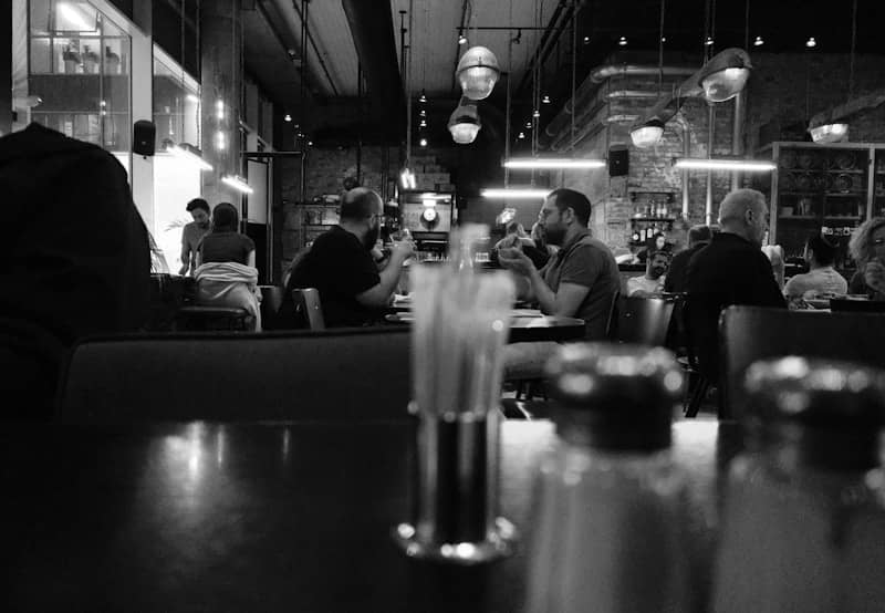 People dining in a dimly lit restaurant.