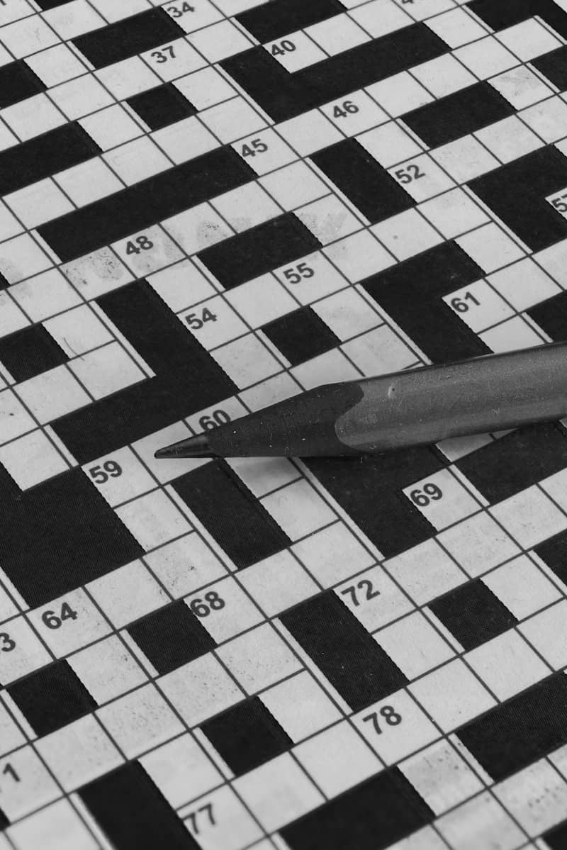 Pencil resting on a crossword puzzle