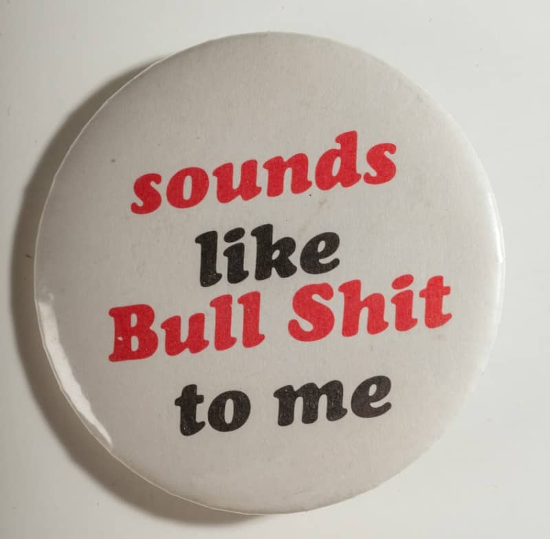 White button with red and black text