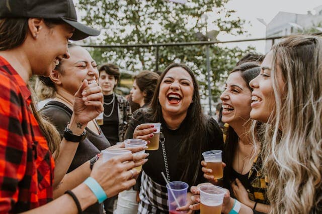 Photo by Paloma Clarice: https://www.pexels.com/photo/women-laughing-while-drinking-beer-at-party-12887817/