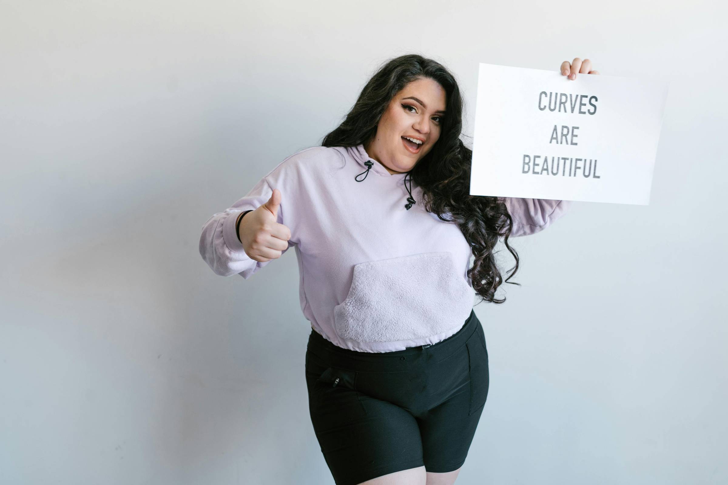 Photo by RDNE Stock project: https://www.pexels.com/photo/confident-woman-holding-a-sign-7239904/