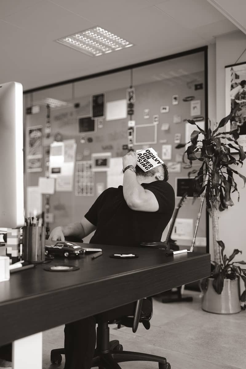 A person sitting at a desk with a computer