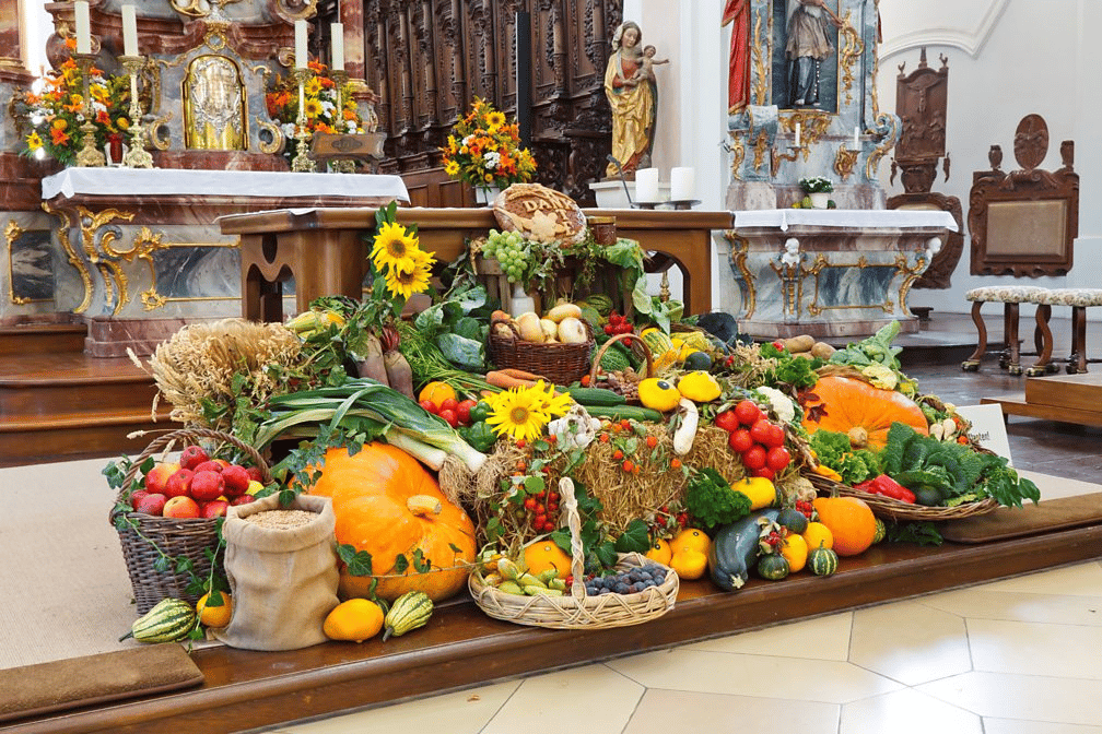 A display in a church of fruit and vegetables to celebrate harvest