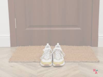 A picture of running shoes near the front door