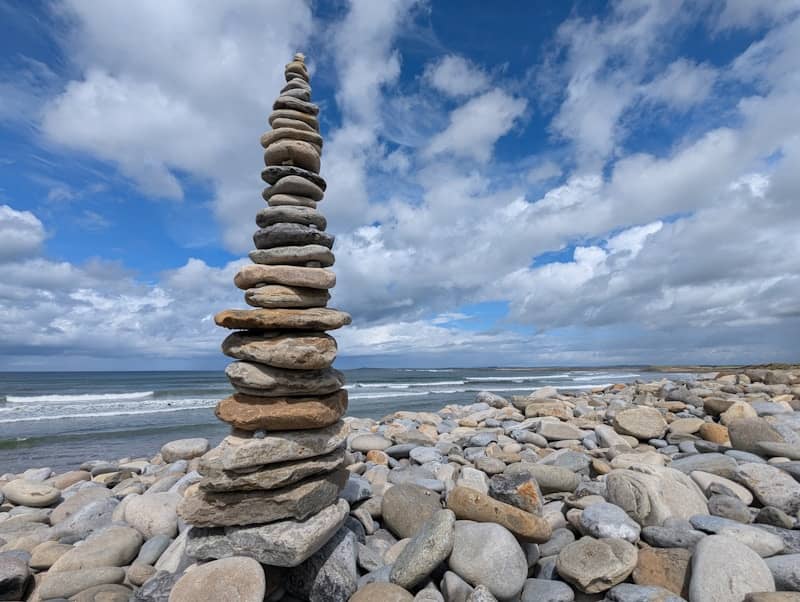 A stack of rocks sitting on top of a beach