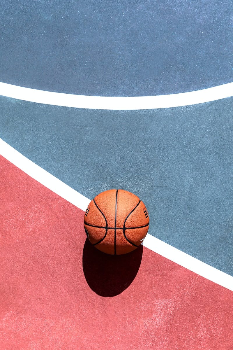 basketball on basketball court during daytime