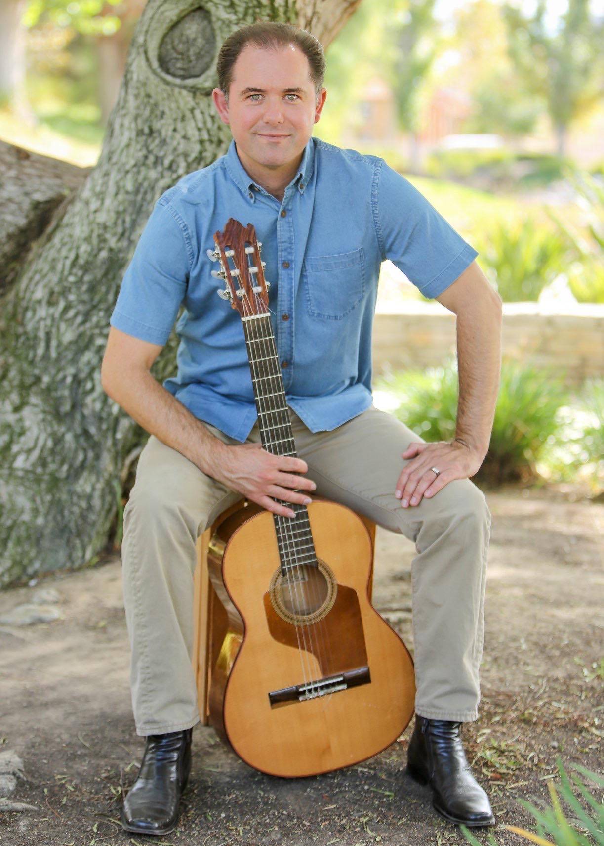 Flamenco Guitarist, Instructor, and Founder of Flamenco4U, Ben Stubbs, Holding his Arturo Valdez Guitar