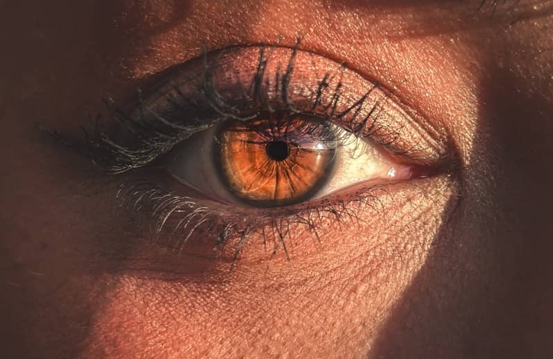 Close-up of a beautiful hazel eye in sunlight.