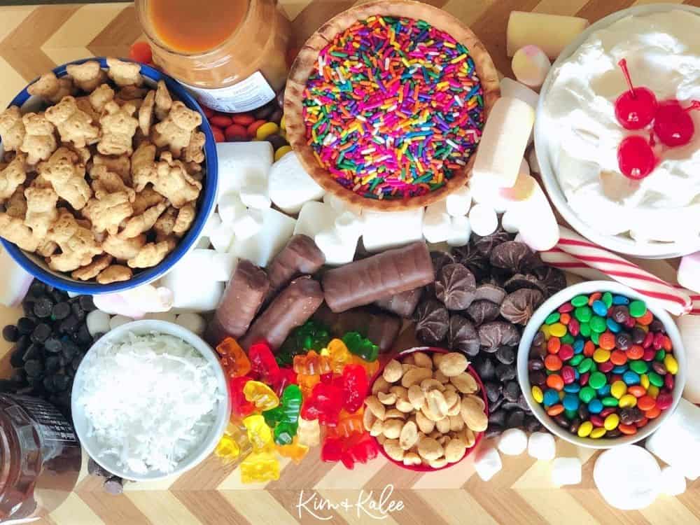 ice cream sundae toppings on charcuterie board