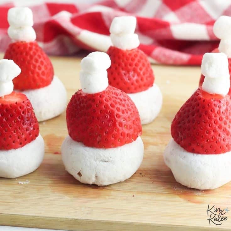 6 santa hats made out of marshmallows and strawberries