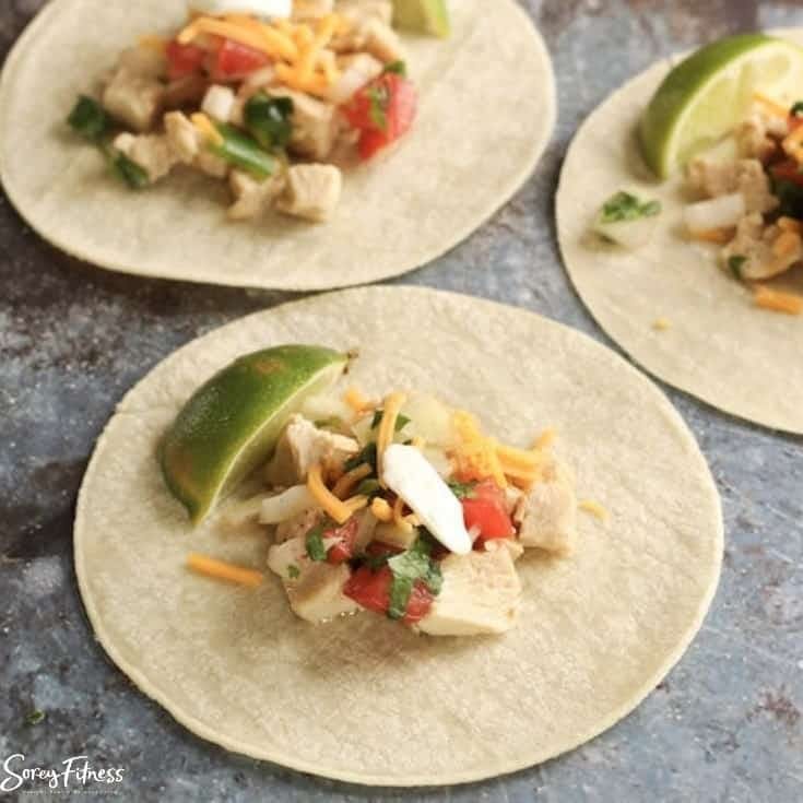 3 healthy chicken street tacos laid flat