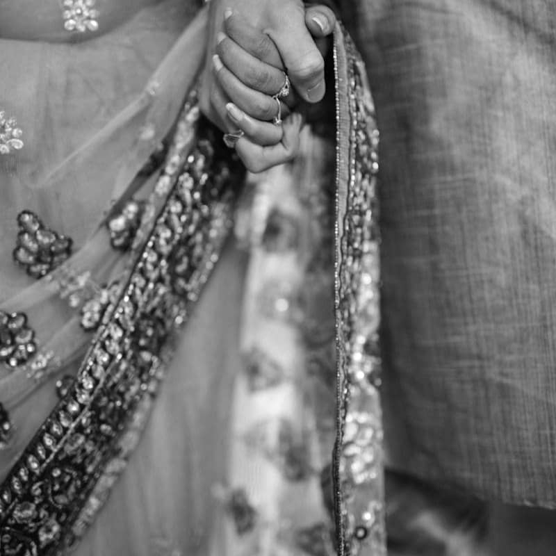 selective focus of two person holding hands