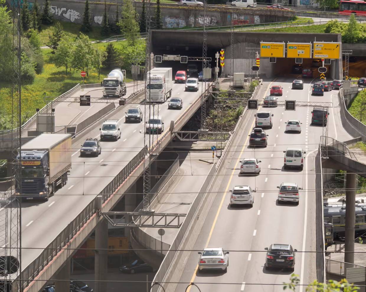 Slightly overhead view of cars on a roadway