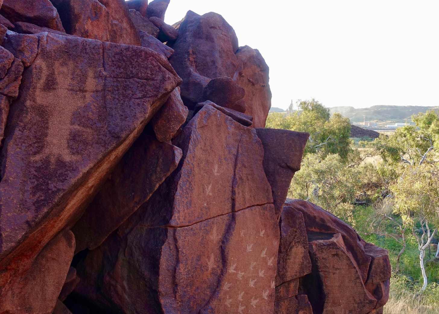 Subtle drawings on the side of a red rock formation