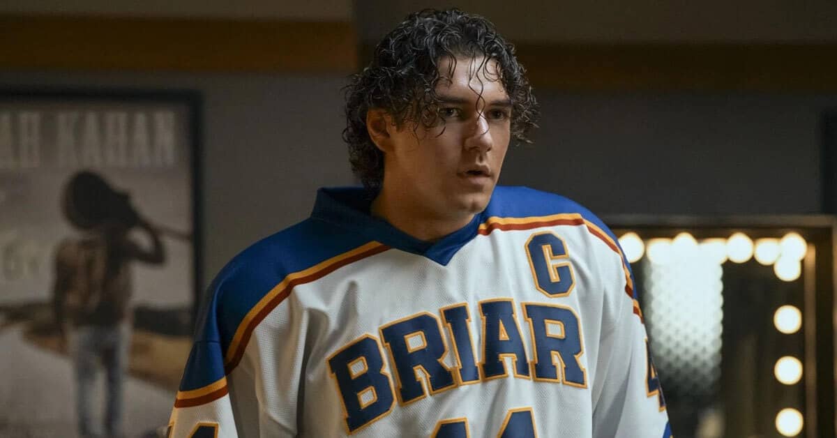 A person wearing a hockey uniform that says "Briar" across the front, looking off-screen