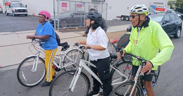 A group of four people on bicycles on a road