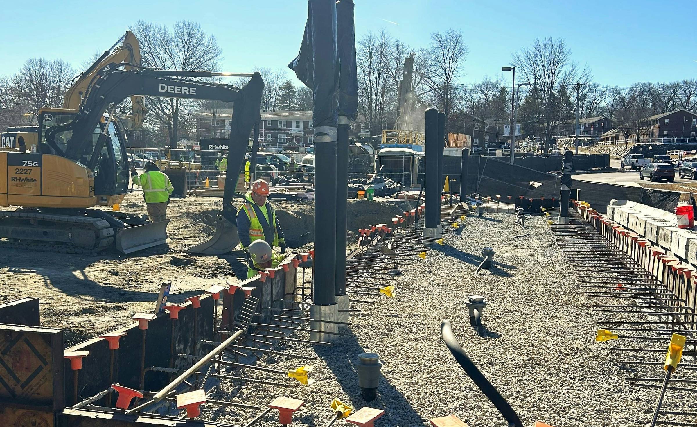 Crews installing geothermal infrastructure at a work site