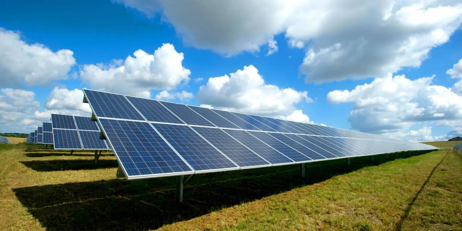 Solar panels in a field on a sunny day