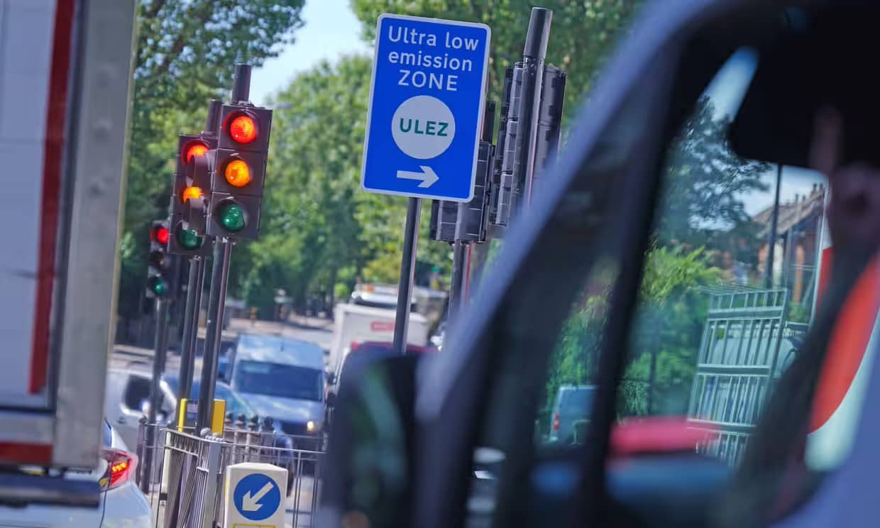 A blue "Ultra low emission zone" street sign