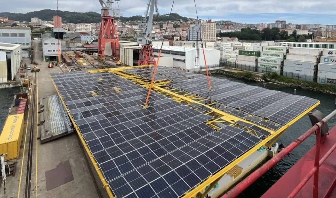 A large offshore photovoltaic platform being prepped in a shipyard