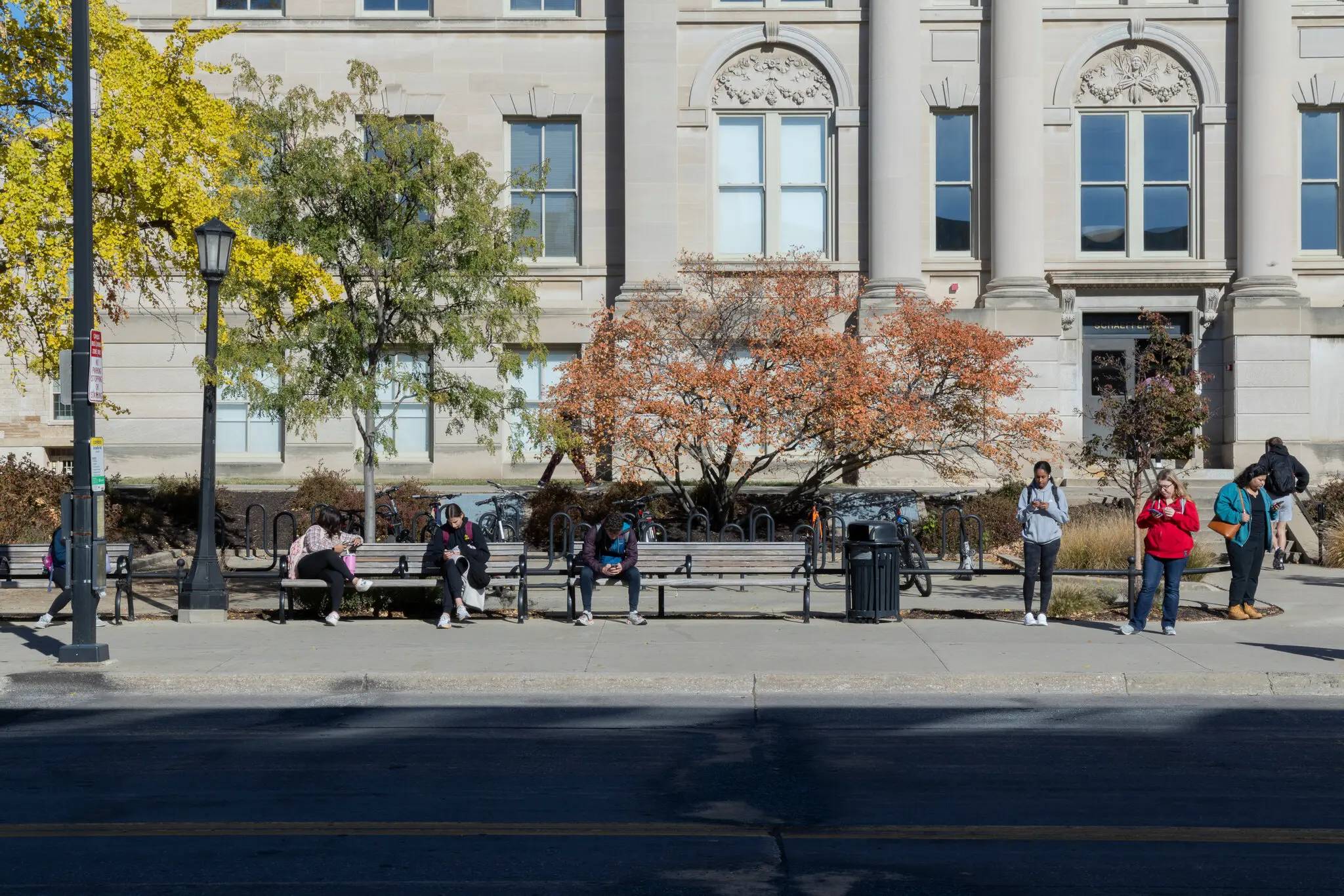 People waiting at a bus stop