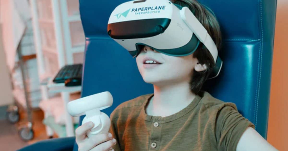 Kid in dentist chair wearing a VR headset