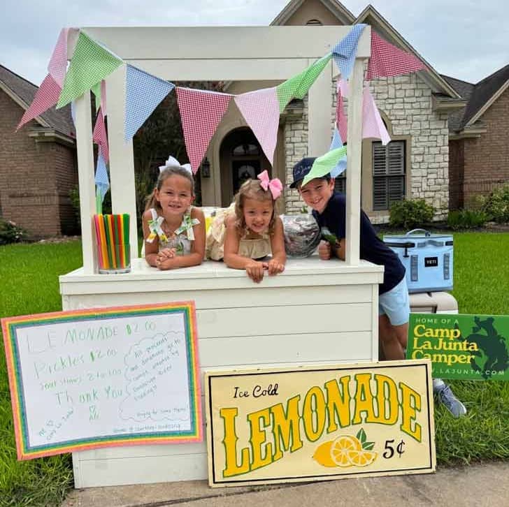 Three kids at a lemonade stand