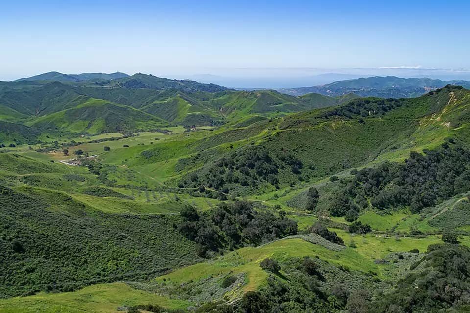 Landscape photo of tree-covered hills and mountains