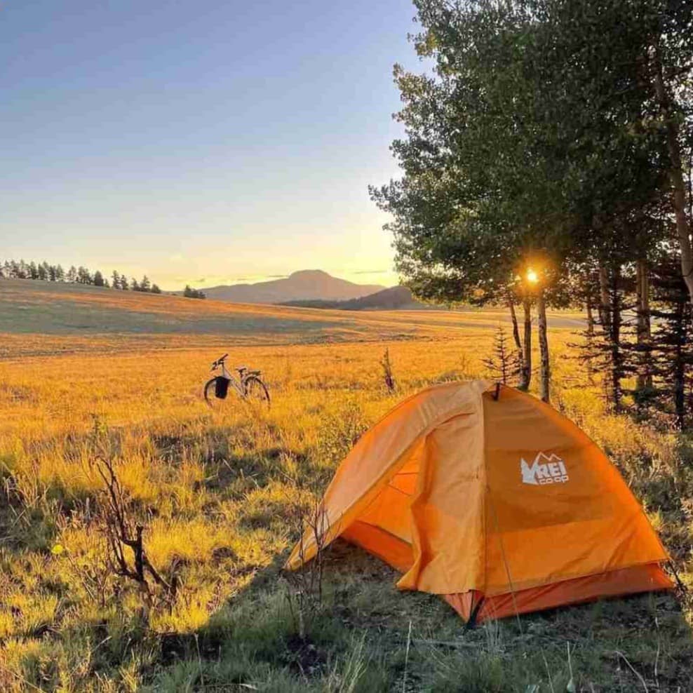 A yellow tent in an outdoor area