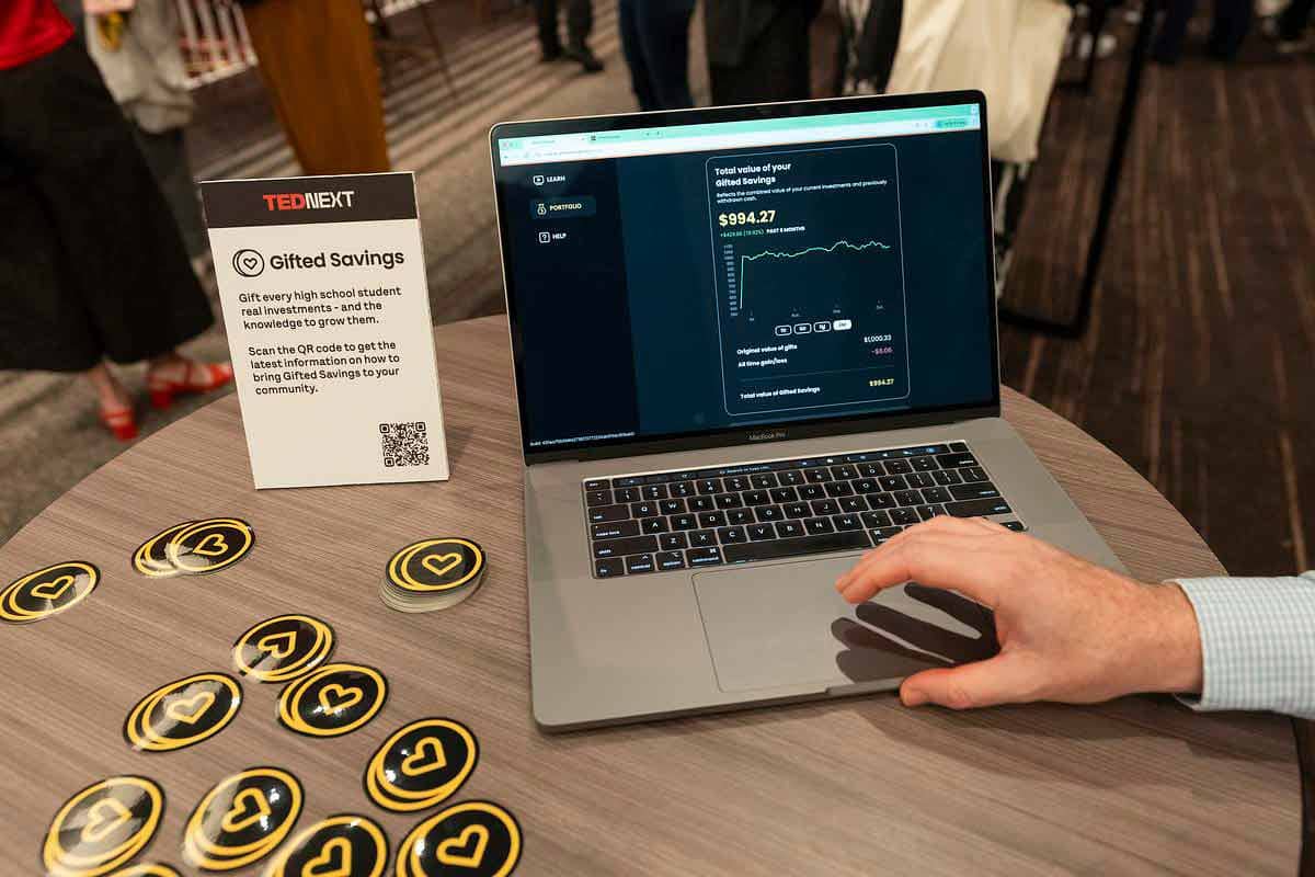 Lap top on a table top with a "total value of your Gifted Savings" web page open