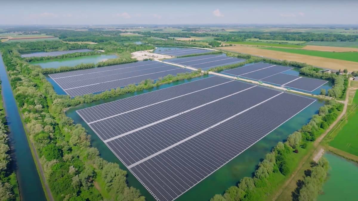 Solar panels over rectangular bodies of water surrounded by land