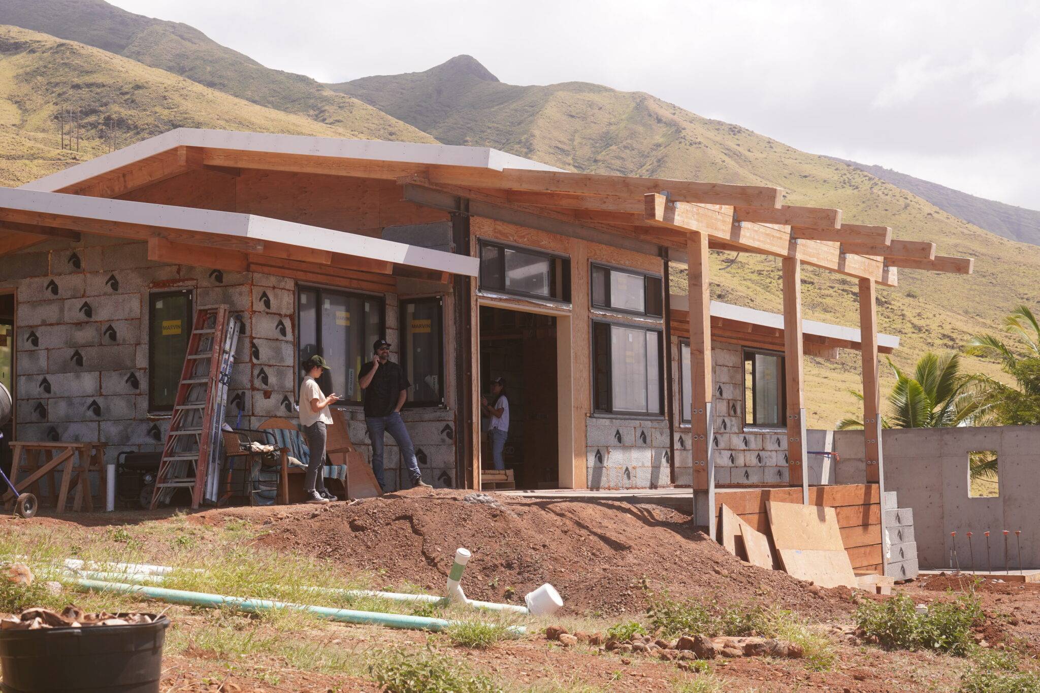 A house under construction on a hillside