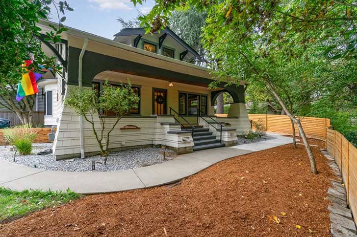 Exterior of a home with a progress pride flag on the outside