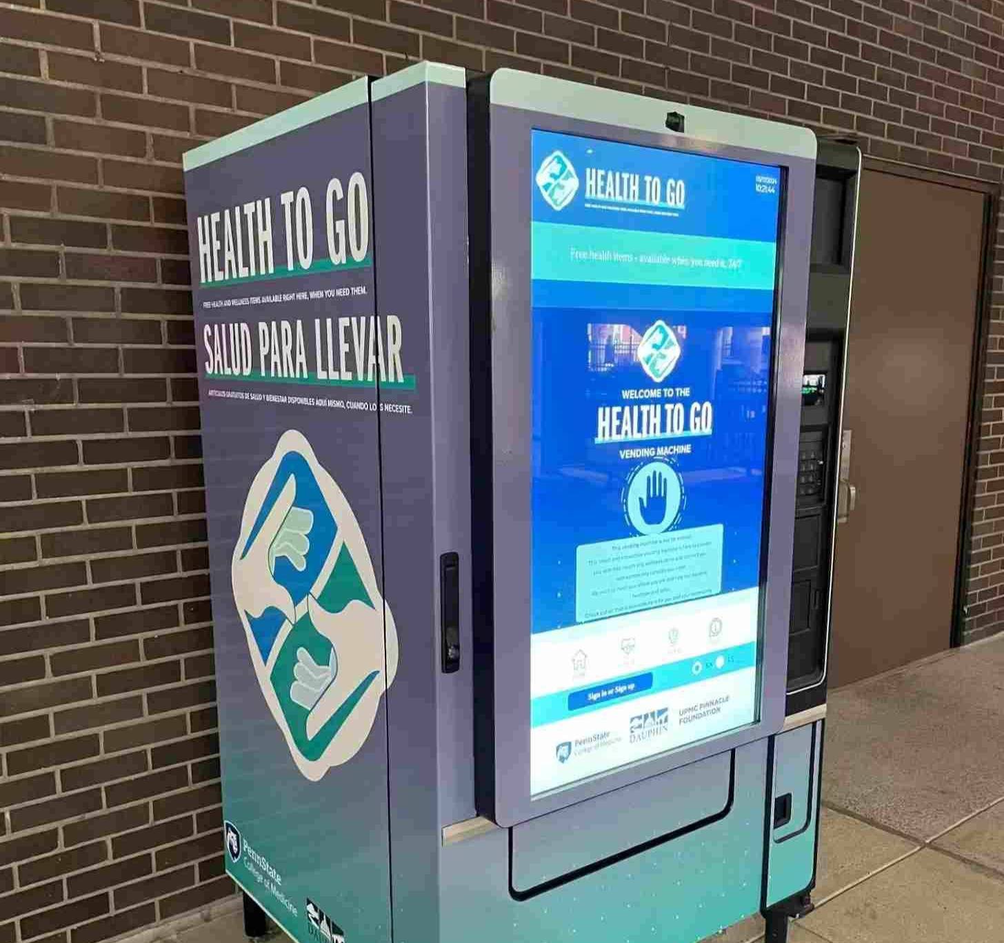 A vending machine that says "Health to go" on the outside