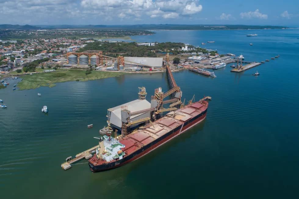 A large barge in the water at a port just offshore
