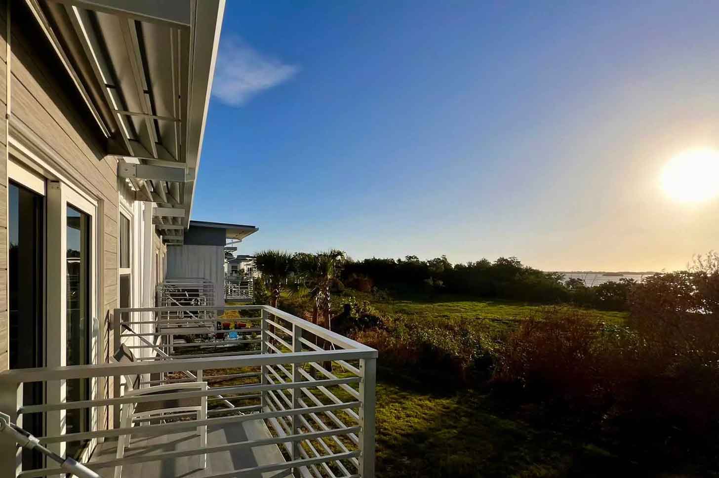 Hotel balconies overlooking nature area