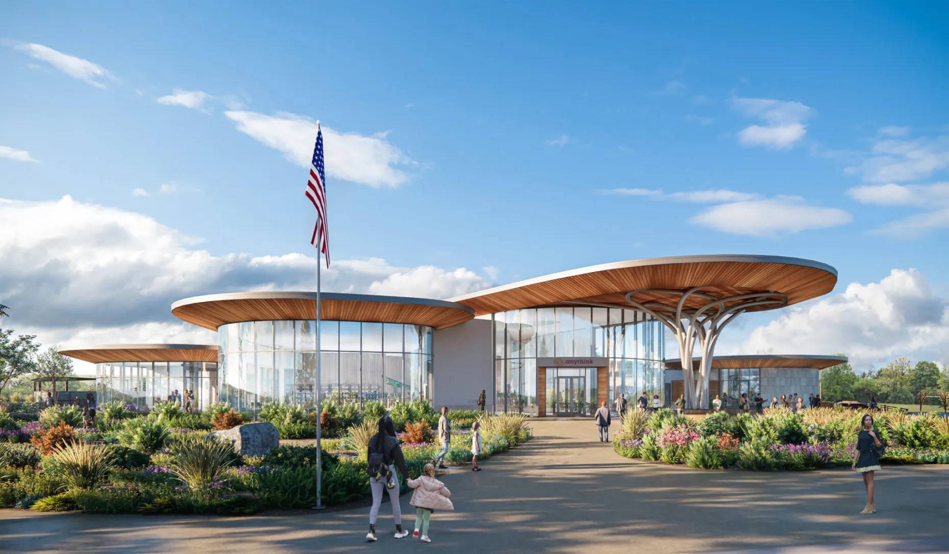 Rendering of a building with circular roofs and people walking around lush landscape