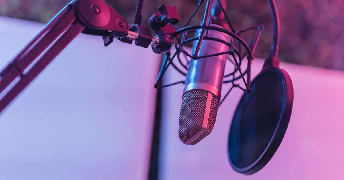 I microphone in a room that's colored purple and pink