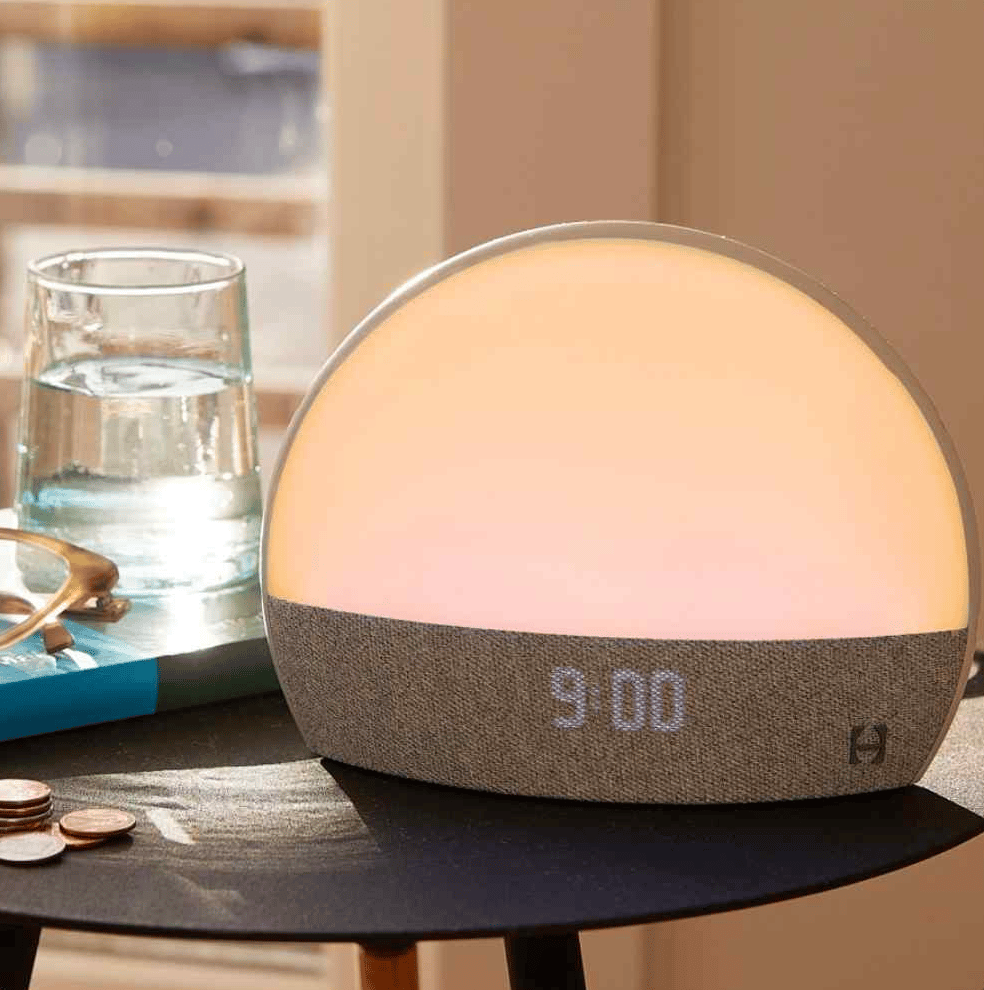 A warm yellow night light on a table top