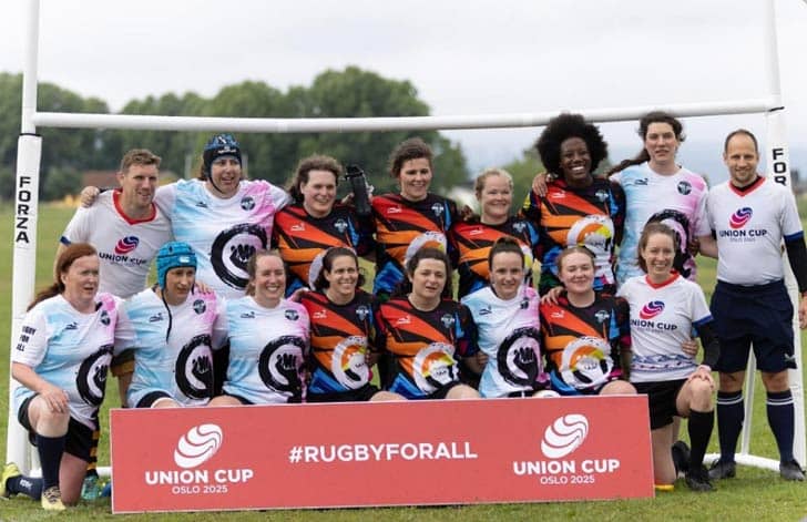 Group photo of rugby players with sign that says #rugbyforall