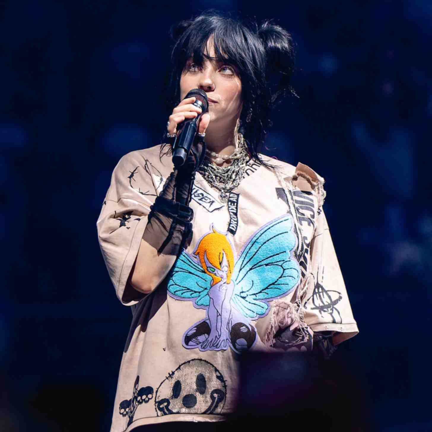 Billie Eilish holding a microphone