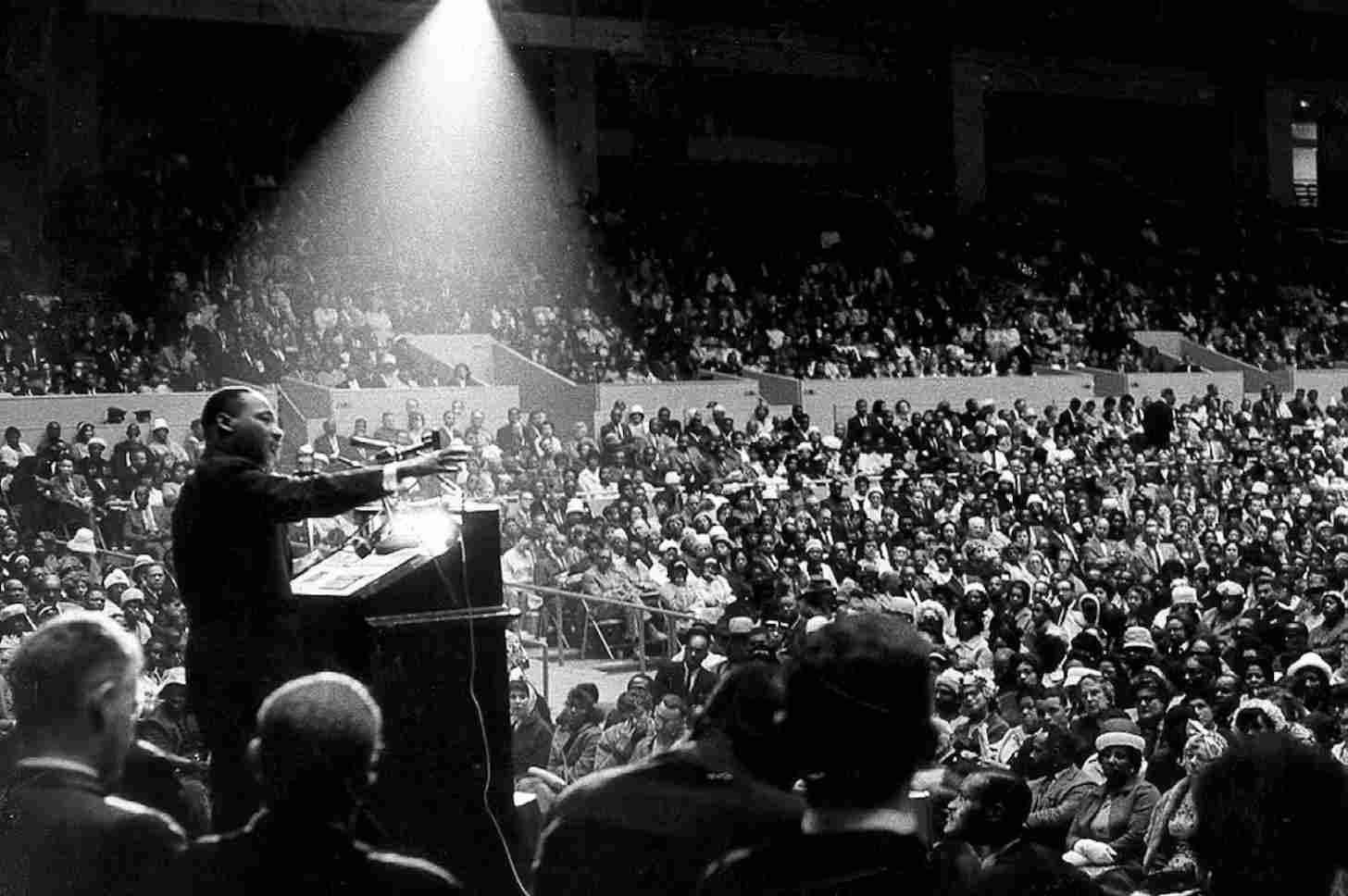 Black and white photo of king speaking to a large crowd