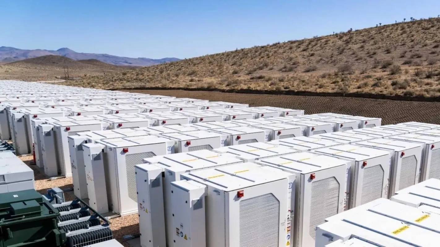 Rows of white boxes with a desert environment around it