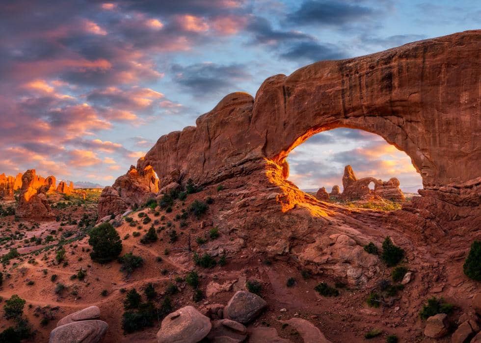 A scenic photo of Arches national park at sunset