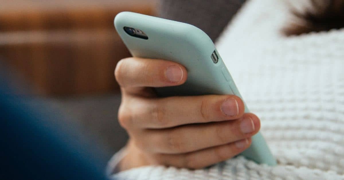 Close-up photo of a person looking at their phone
