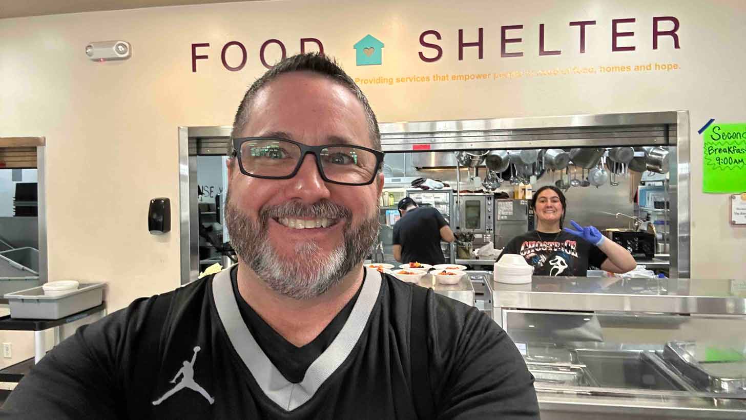 Doug Ruch taking a selfie in a food shelter