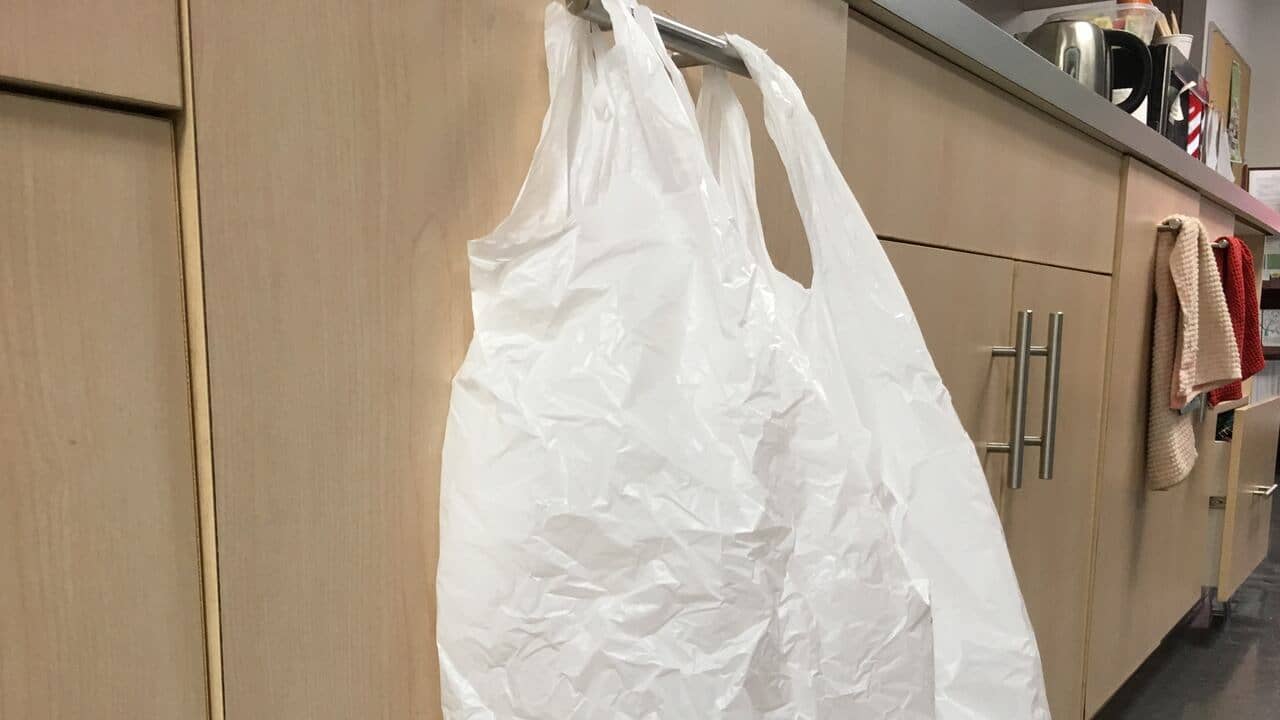 White plastic bag around a cabinet handle