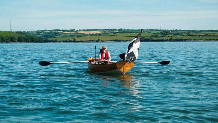 Person in a wooden row boat
